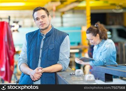 portrait of a young man in factory