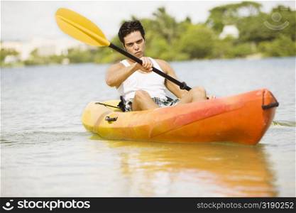 Portrait of a young man kayaking