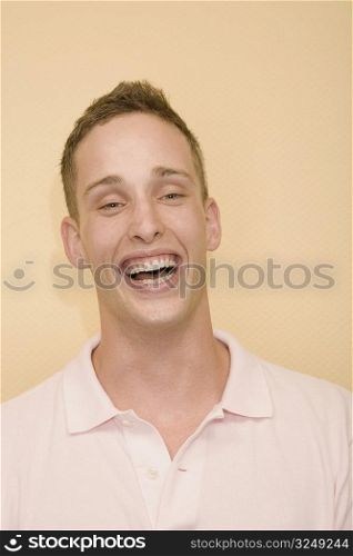 Portrait of a young man laughing