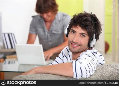 portrait of a young man listening to music