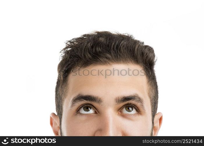 Portrait of a young man looking up, isolated on white