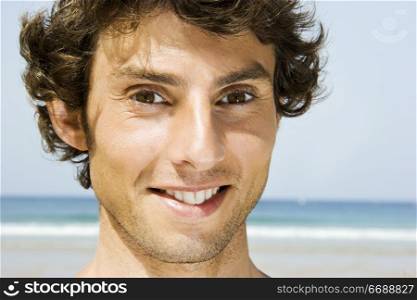 Portrait of a young man on the beach