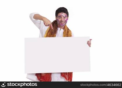 Portrait of a young man pointing to a white board