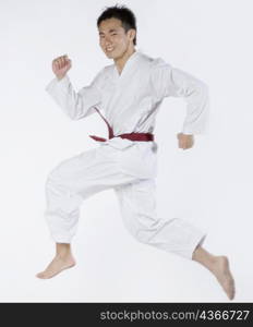 Portrait of a young man practicing kickboxing