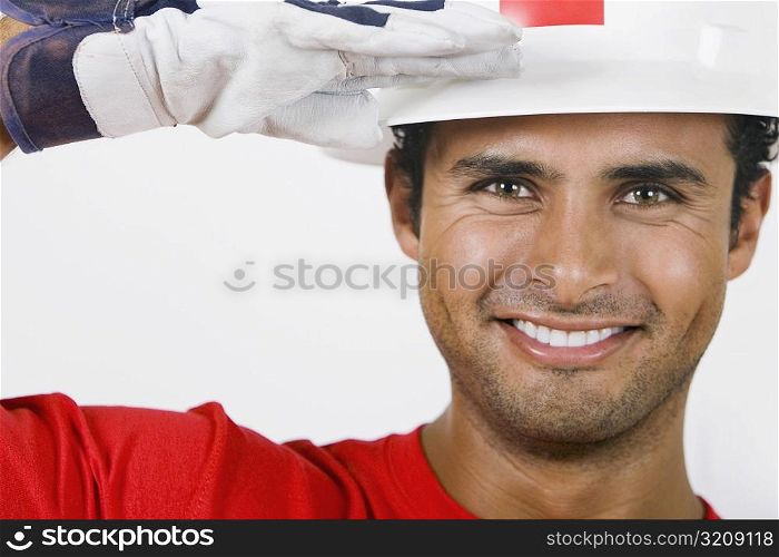 Portrait of a young man saluting