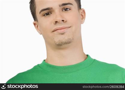 Portrait of a young man smirking