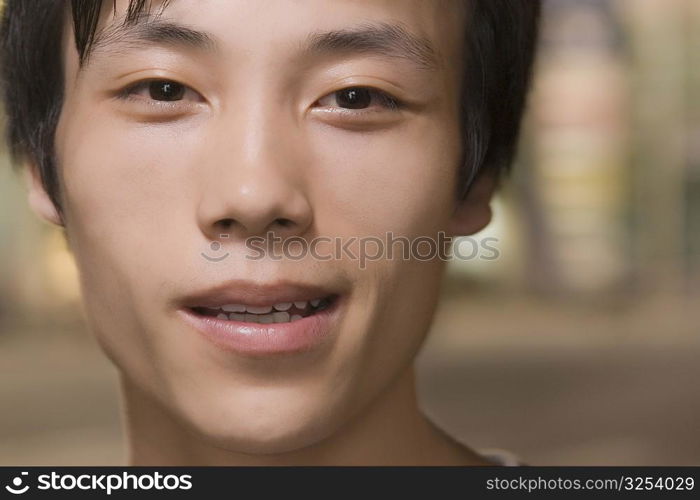 Portrait of a young man smirking