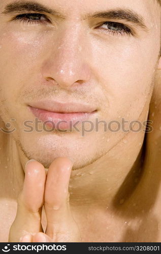 Portrait of a young man squinting