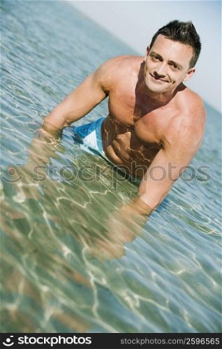 Portrait of a young man standing in water