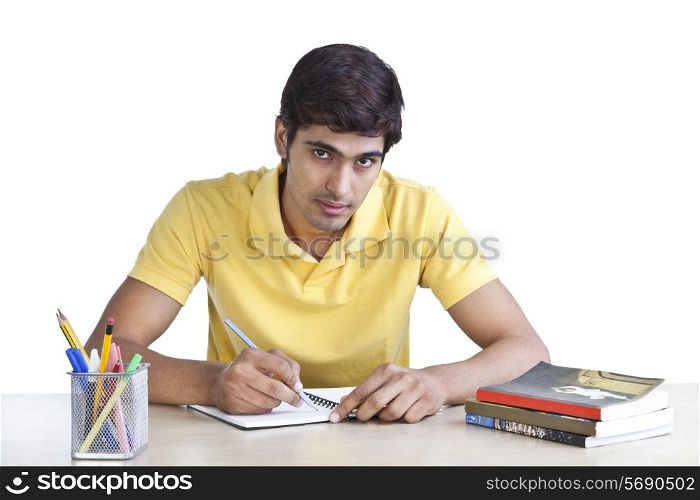 Portrait of a young man studying
