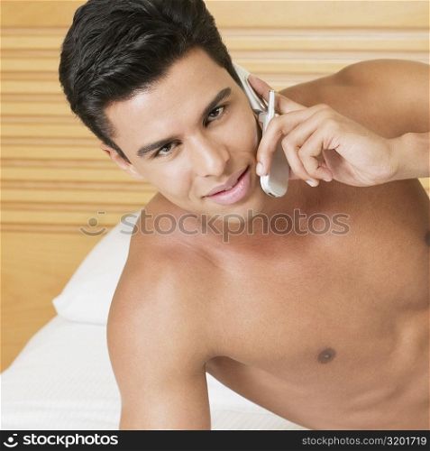 Portrait of a young man talking on a mobile phone