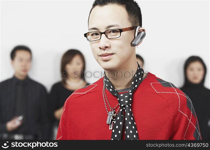 Portrait of a young man using a hands free device