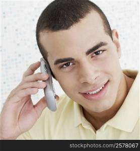 Portrait of a young man using a mobile phone