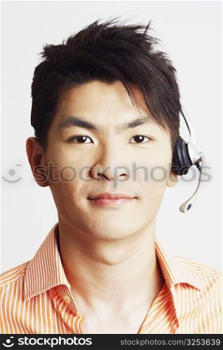 Portrait of a young man wearing a headset