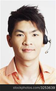 Portrait of a young man wearing a headset