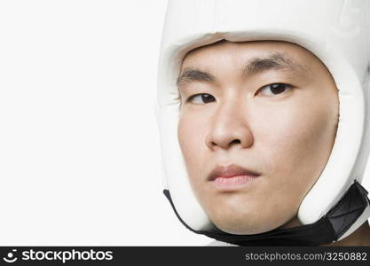 Portrait of a young man wearing a sports helmet