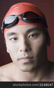 Portrait of a young man wearing a swimming cap