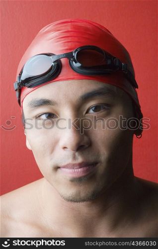 Portrait of a young man wearing a swimming cap