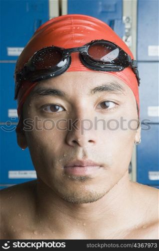 Portrait of a young man wearing swimming cap