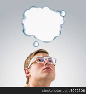 Portrait of a young man with a blank speech bubble over his head