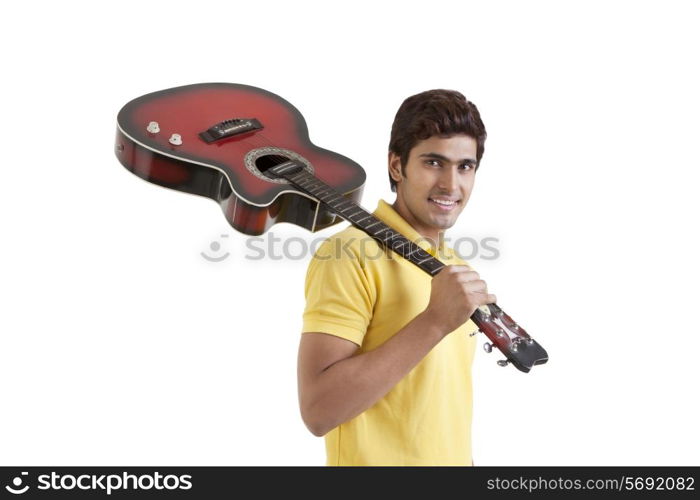 Portrait of a young man with a guitar