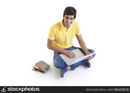 Portrait of a young man with a laptop