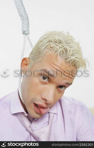 Portrait of a young man with a noose around his neck