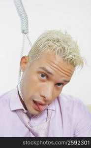 Portrait of a young man with a noose around his neck