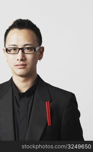 Portrait of a young man with a pair of chopsticks in his pocket