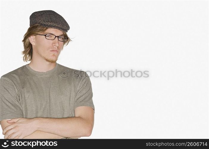 Portrait of a young man with his arms crossed