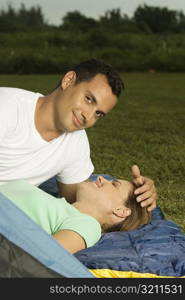 Portrait of a young man with his hand on a young woman&acute;s head