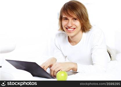 Portrait of a young man with notebook