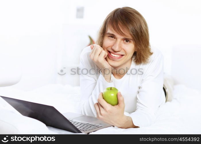 Portrait of a young man with notebook