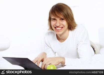 Portrait of a young man with notebook