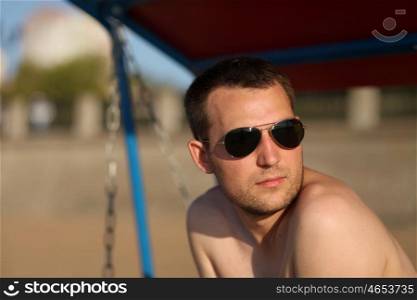 portrait of a young men in sunglasses