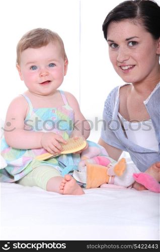 Portrait of a young mum and baby girl