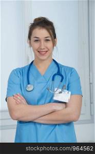 portrait of a young nurse in blue uniform