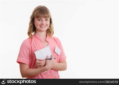 Portrait of a young pretty girl medical worker on a white background