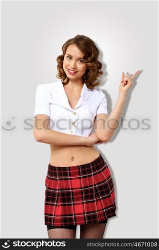 Portrait of a young pretty woman dressed in retro style