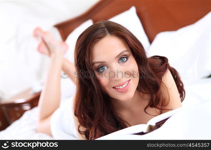 portrait of a young pretty woman in bed in underwear