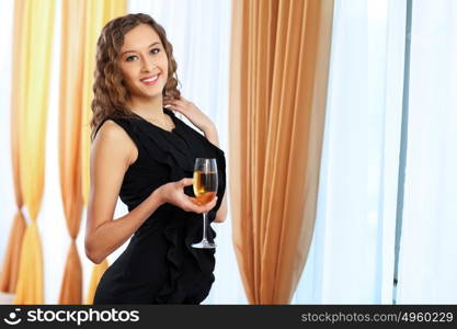 Portrait of a young pretty woman sitting in restaurant