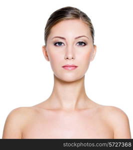 Portrait of a young pretty woman with clean skin on a white background