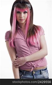 Portrait of a young punk girl with a nice hair cut in pink