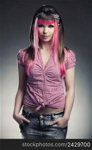Portrait of a young punk girl with a nice hair cut in pink