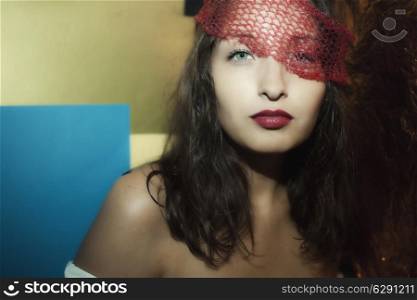 Portrait of a young sensual brunette in veil