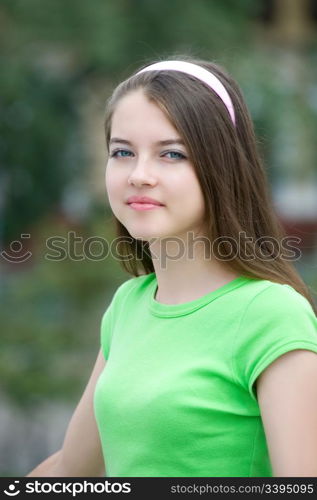 portrait of a young smiling beautiful european girl looking into camera