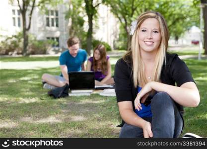 Portrait of a young student outdoors on campus.