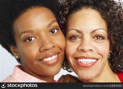Portrait of a young woman and a mature woman smiling