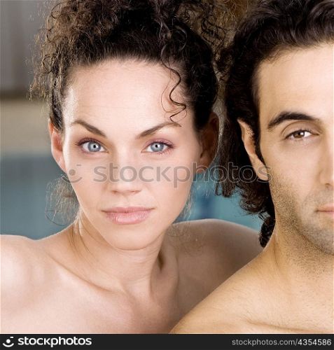 Portrait of a young woman and a mid adult man