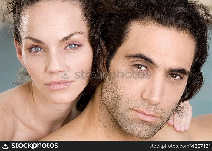 Portrait of a young woman and a mid adult man